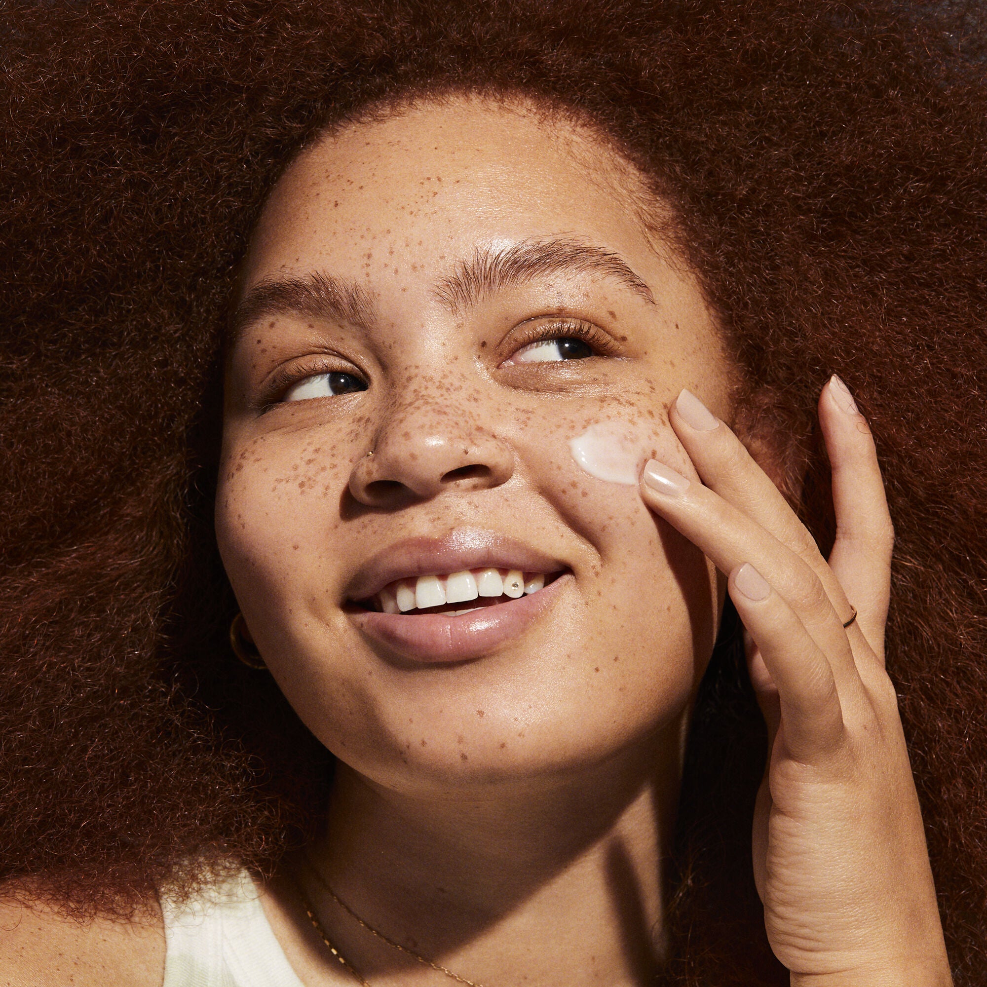 Model Applying Gel Cream Moisturizer